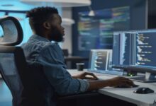 Student researching “is a masters in cybersecurity worth it” on a laptop