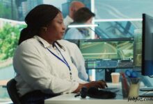 Image of a professional at a computer monitoring