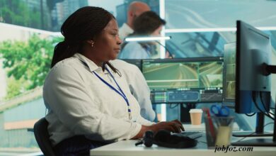 Image of a professional at a computer monitoring